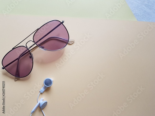 sunglasses, headphones on white background
