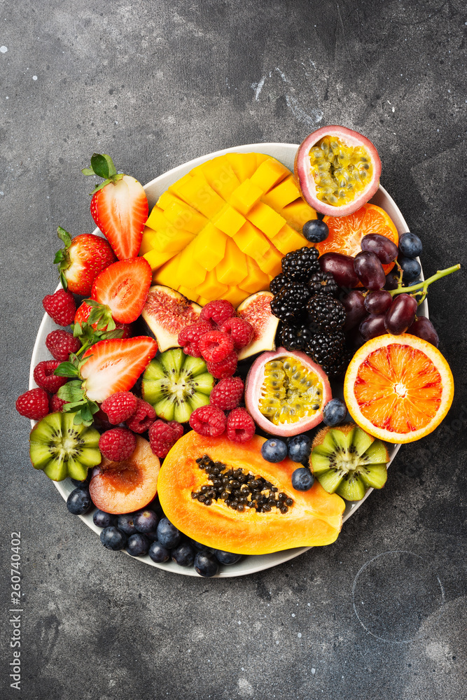 Delicious fruit platter mango papaya oranges passion fruits berries on