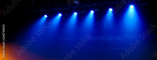 Blue light on the stage at a concert as a background