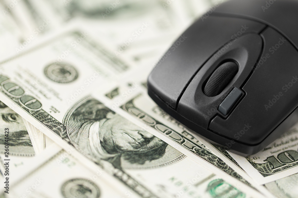 business, internet earning and finance concept - close up of computer mouse on us dollar money business, internet earning and finance concept - close up of computer mouse on us dollar money