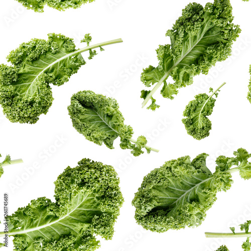 Seamless pattern with green kale leaf isolated on white. Vegetable background. Food texture. Close-up photo.
