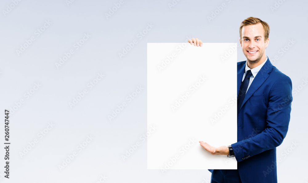 businessman showing signboard with copyspase businessman showing signboard with copyspase