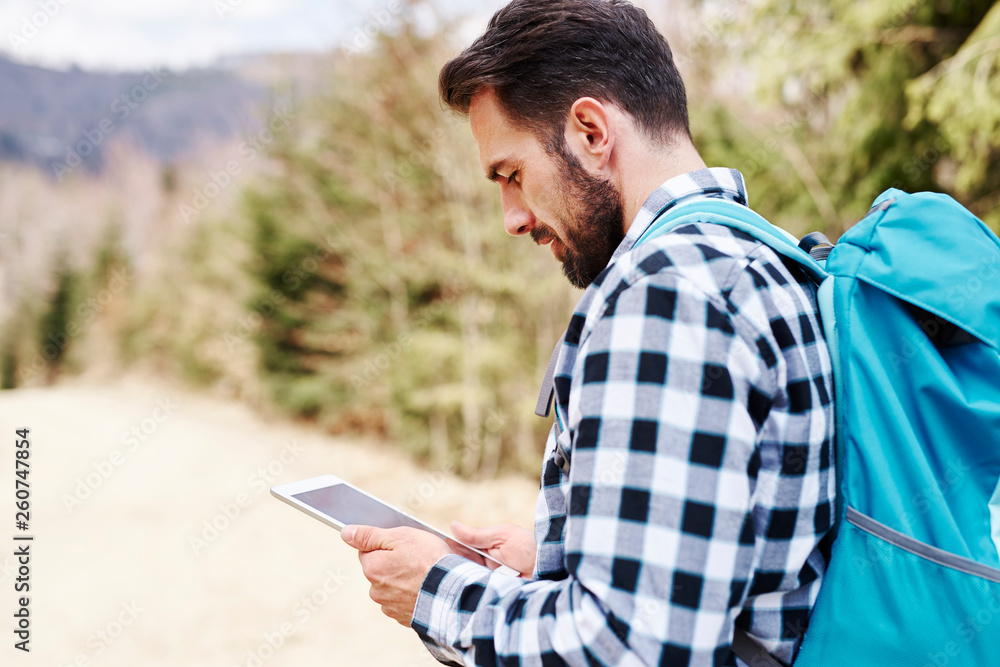 Mature man choosing the best path for hiking Mature man choosing the best path for hiking