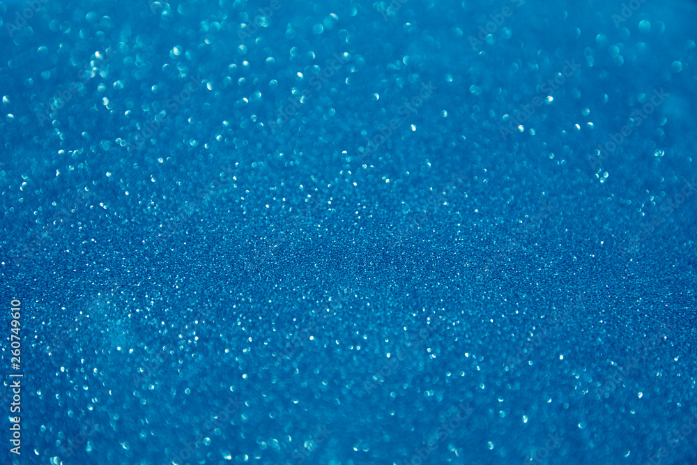 Obraz premium blue glittering christmas lights. Blurred abstract holiday background