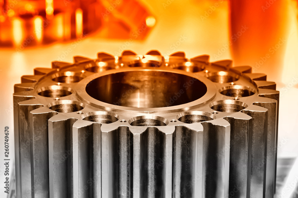 Industrial gear on light background. Red toned Industrial gear on light background. Red toned