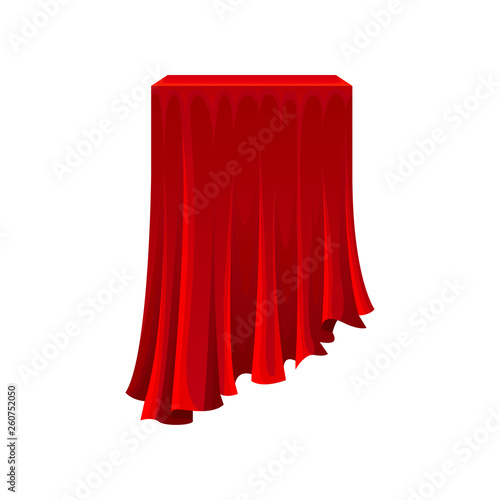 Table under red silk cloth on white background.