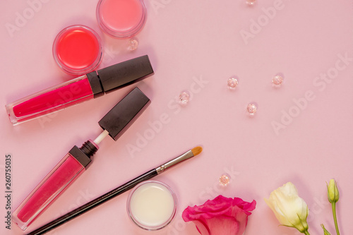 Lip gloss and lip care balm, still life with different shades. Cosmetics