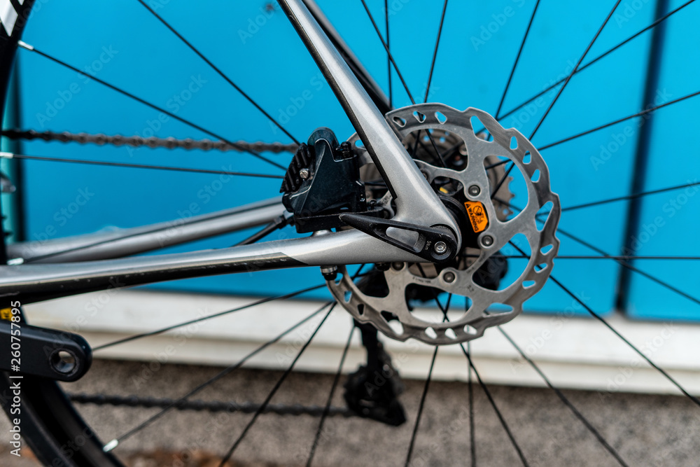 Bycicle racing brake system with polished rotor and black caliper