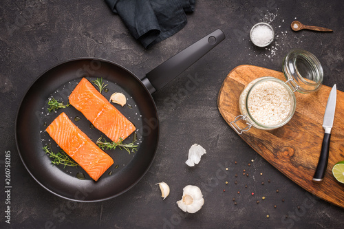 Salmon Steaks Fresh and Raw in Frying Pan with Thyme and Garlic