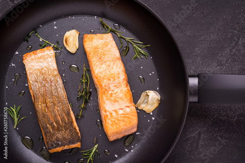 Grilled Salmon Fillets in Frying Pan with Thyme and Garlic