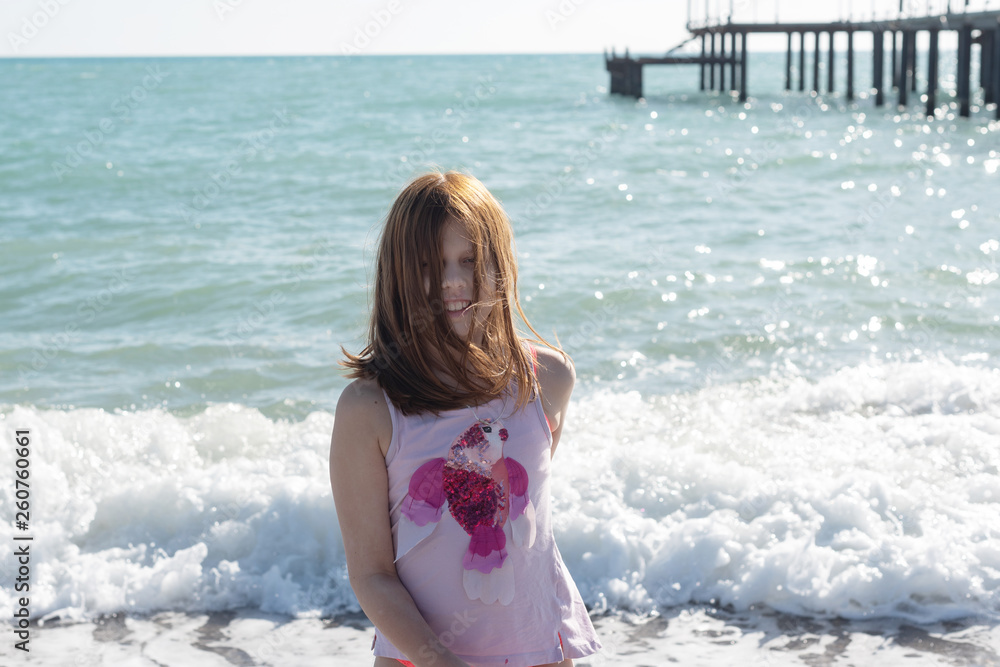 lifestyle portrait of a little girl by the sea Stock Photo | Adobe Stock