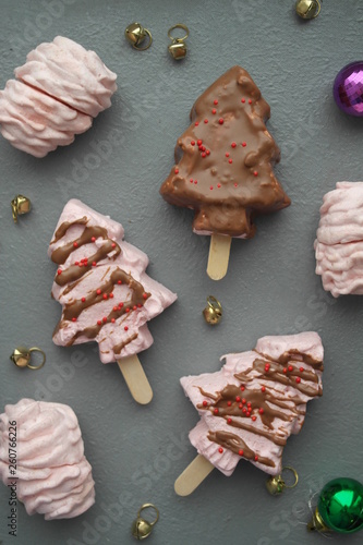 marshmallows in chocolate in the form of trees on a stick