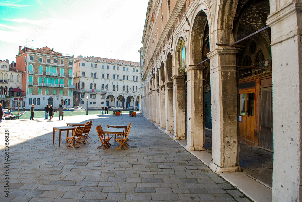 Bistro Set on stone square along the main canal in Venice Italy