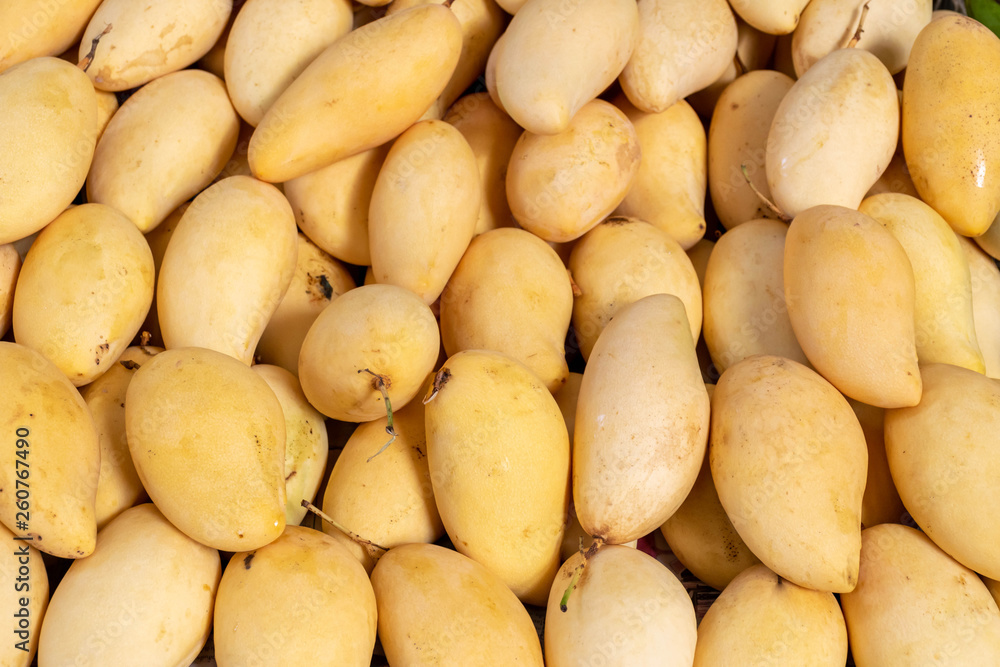 Close up of Ripe mangoes sold in the fruit market Close up of Ripe mangoes sold in the fruit market