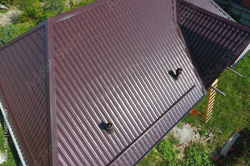Wallpaper Mural A view from above on the roof of the house. The roof of corrugated sheet. Roofing of metal profile wavy shape Torontodigital.ca