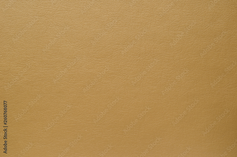 The texture of the surface of artificial brown skin warm shade.