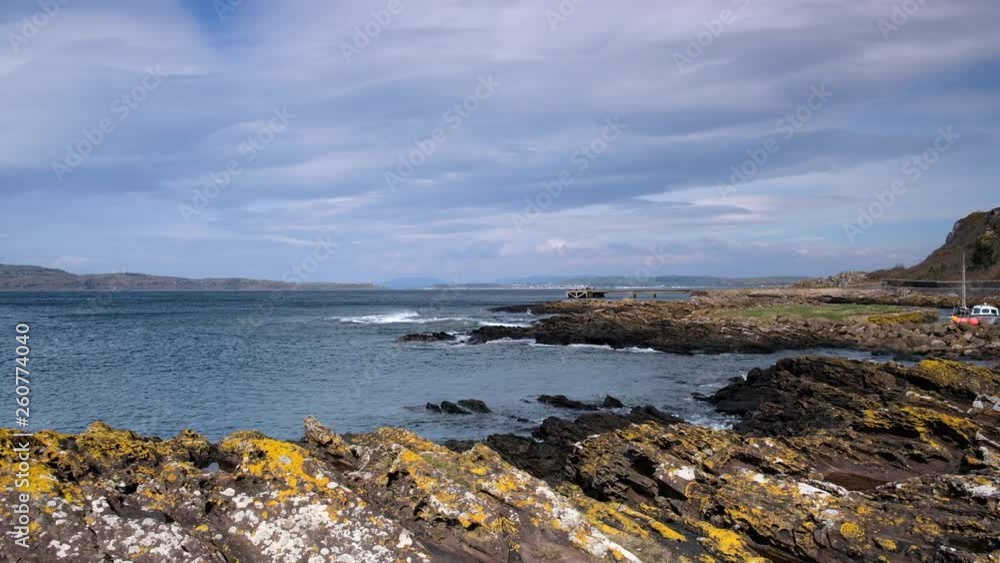 Scotlands Rocky Jagged Shore Line with Waves Breaking Over the Rocks.