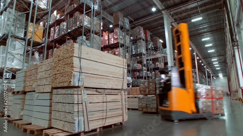 A variety of goods and cargo on the shelves in a large warehouse