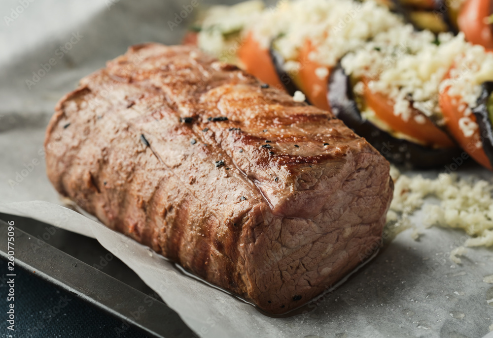 Veal tenderloin with vegetables, eggplants and tomatoes. Veal tenderloin with vegetables, eggplants and tomatoes.