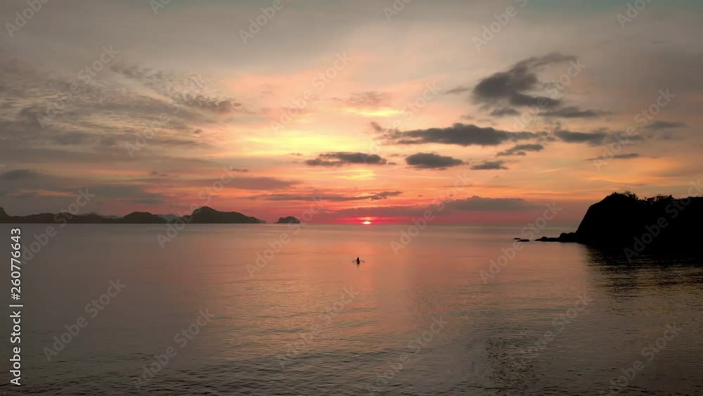 Filipino fishing boat at sunset on open water Filipino fishing boat at sunset on open water