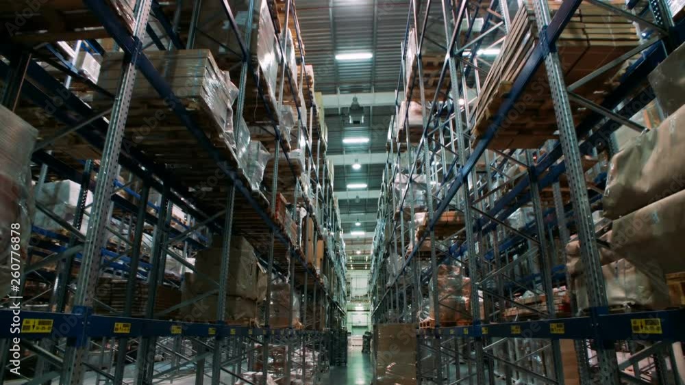 A variety of goods and cargo on the shelves in a large warehouse A variety of goods and cargo on the shelves in a large warehouse