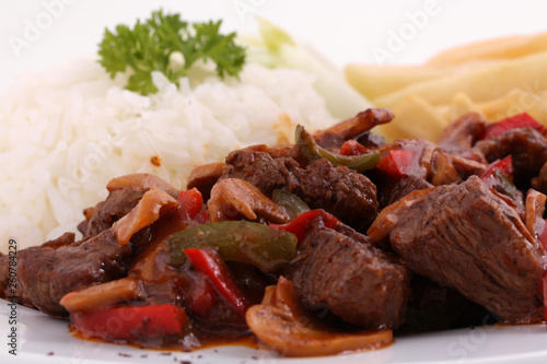 Close-Up of Juicy Lamb Kebab Skewer with Fragrant Rice & Crispy Fries - Middle Eastern Mixed Grill Plate, Food Photography