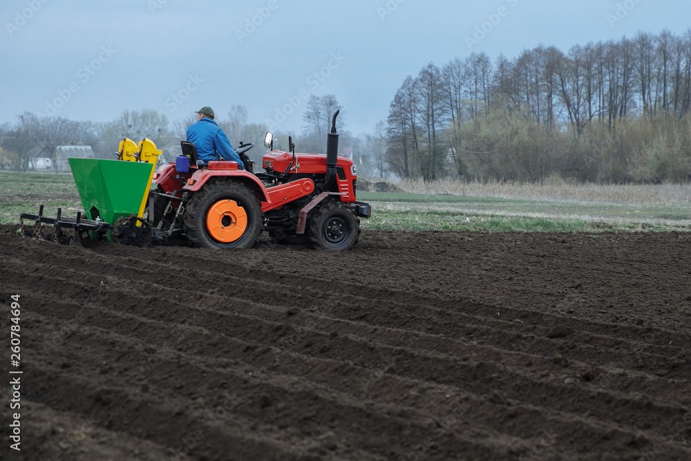 the tractor is developing the ground the tractor is developing the ground