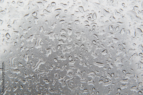 water drops on grey metal surface