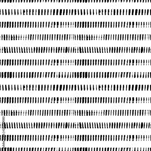 Grunge short lines hand drawn seamless pattern. Vertical scribbles, hatches paintbrush drawing.