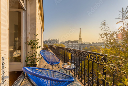 beautiful paris balcony at sunset with eiffel tower view  photo
