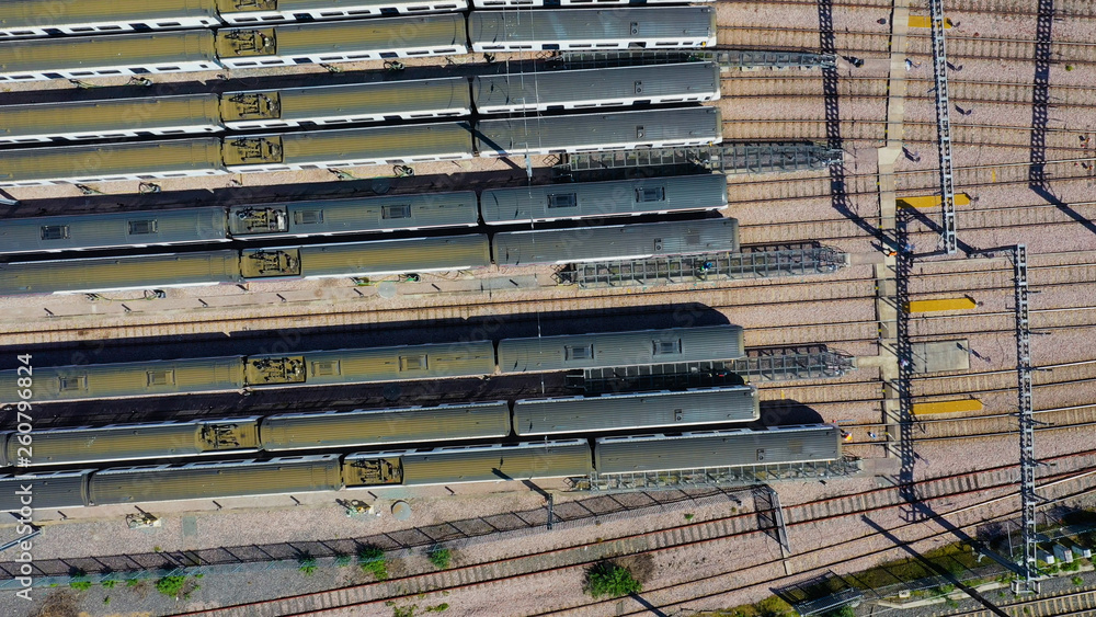 Aerial view over passenger trains in rows at a station