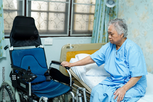 Asian senior or elderly old lady woman patient with electric wheelchair at nursing hospital ward : healthy strong medical concept 