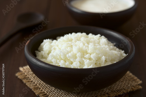 Kefir grains in rustic bowl, photographed with natural light (Selective Focus, Focus one third into the kefir grains)