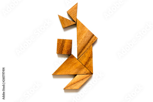 Wood tangram puzzle in dancing man shape on white background  Concept for happiness  joy 
