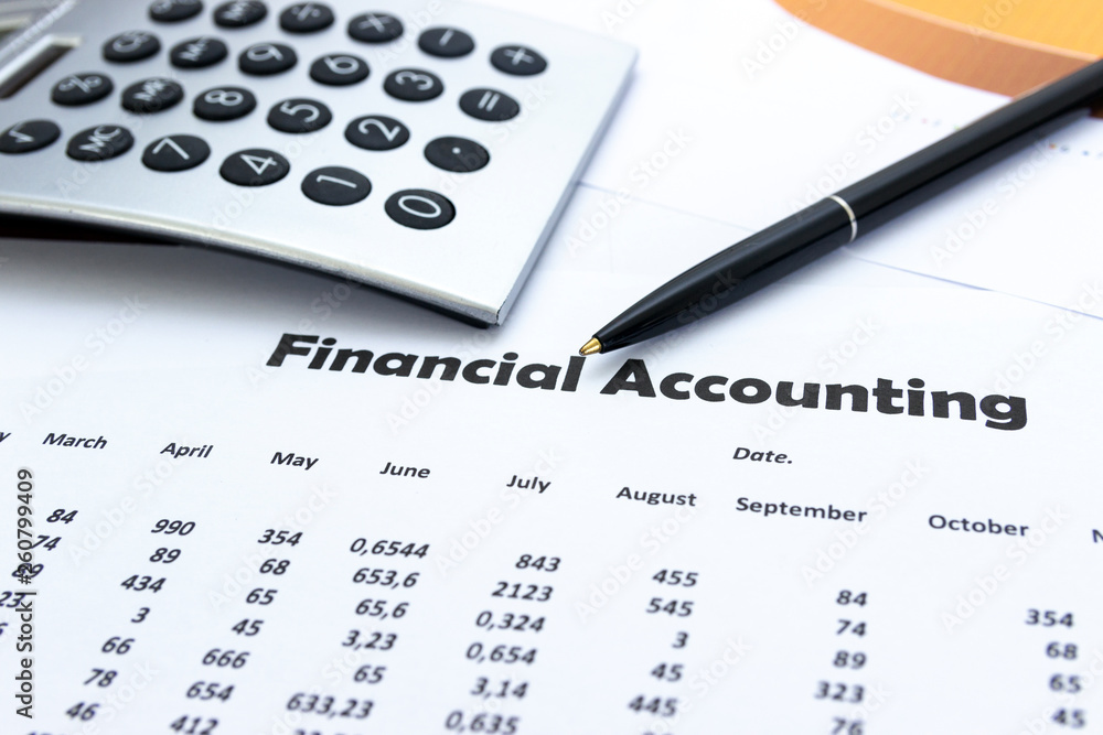calculator and stationery items on the table, Financial accounting. calculator and stationery items on the table, Financial accounting.