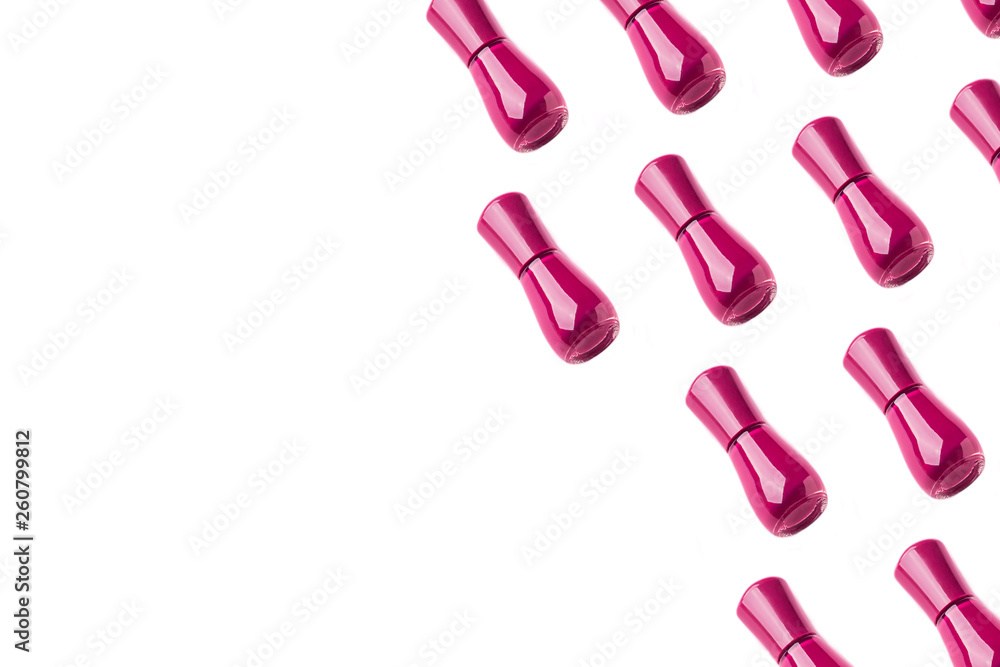 Dark pink nail polish bottle pattern on white Dark pink nail polish bottle pattern on white