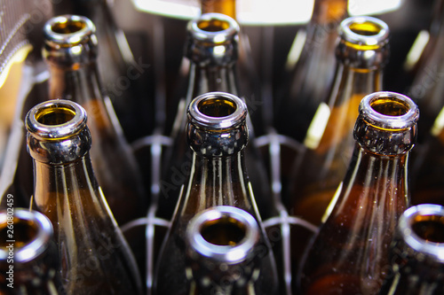 Close up of brown empty beer bottles in a case