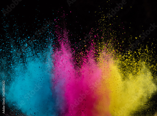 Explosion of colored powder isolated on black