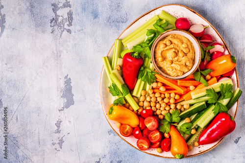 Hummus with various fresh raw vegetables.