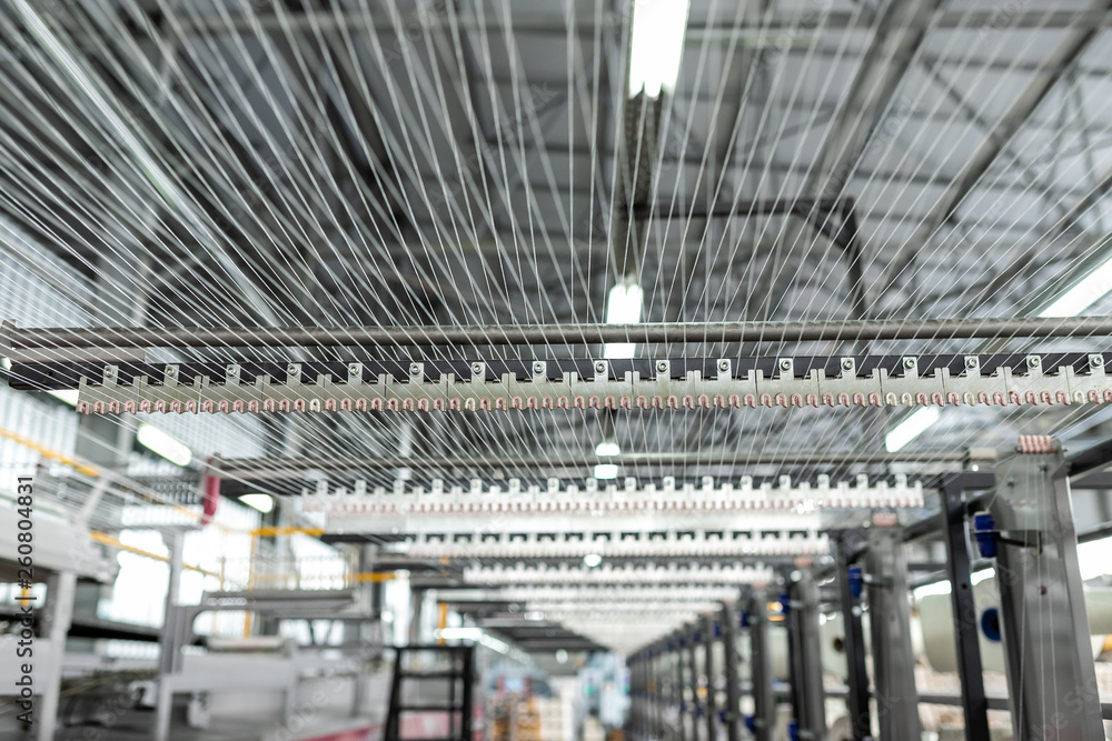 Fototapeta premium Carpet factory, carpet production, synthetic yarns for weaving looms