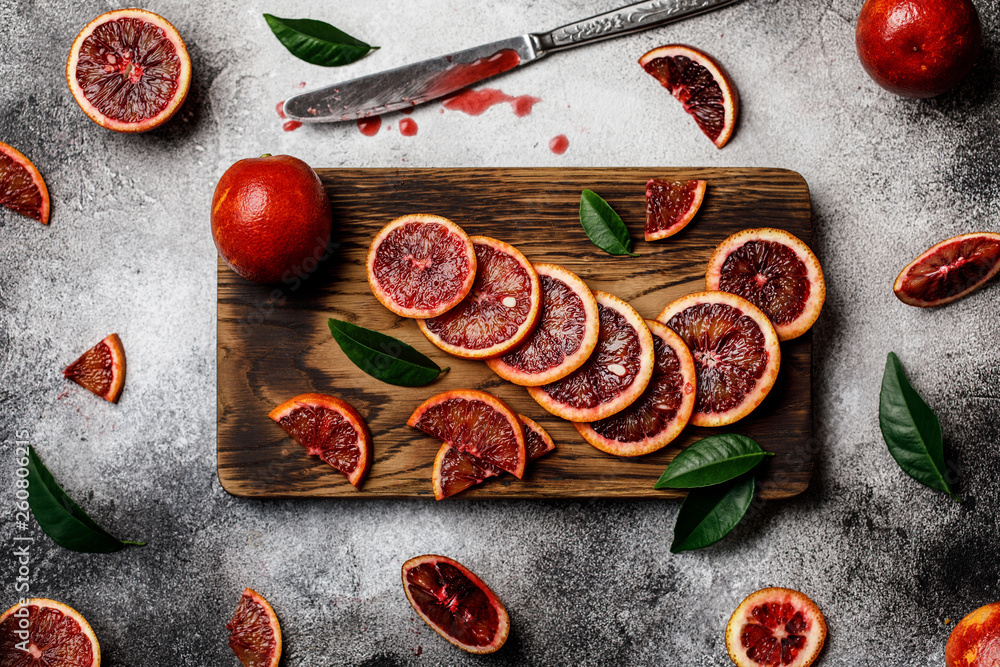 Fresh ripe red oranges on dark background. Healthy orange fruits background many orange fruits. Fresh ripe red oranges on dark background. Healthy orange fruits background many orange fruits.