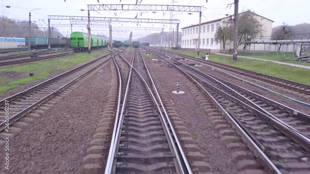 Aerial fly from train tracks on railway