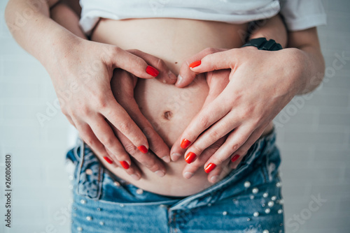 Wallpaper Mural pregnant tummy that holds hands Torontodigital.ca
