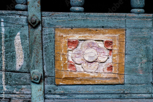 Artwork on old wooden carriage