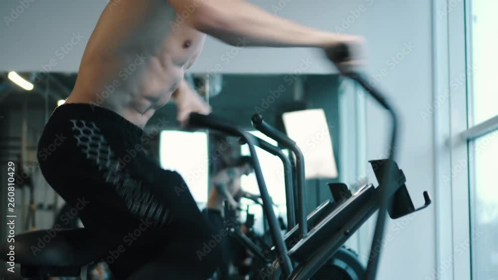 Strongman Doing Aerobics Elliptical Walker Strongman Doing Aerobics Elliptical Walker