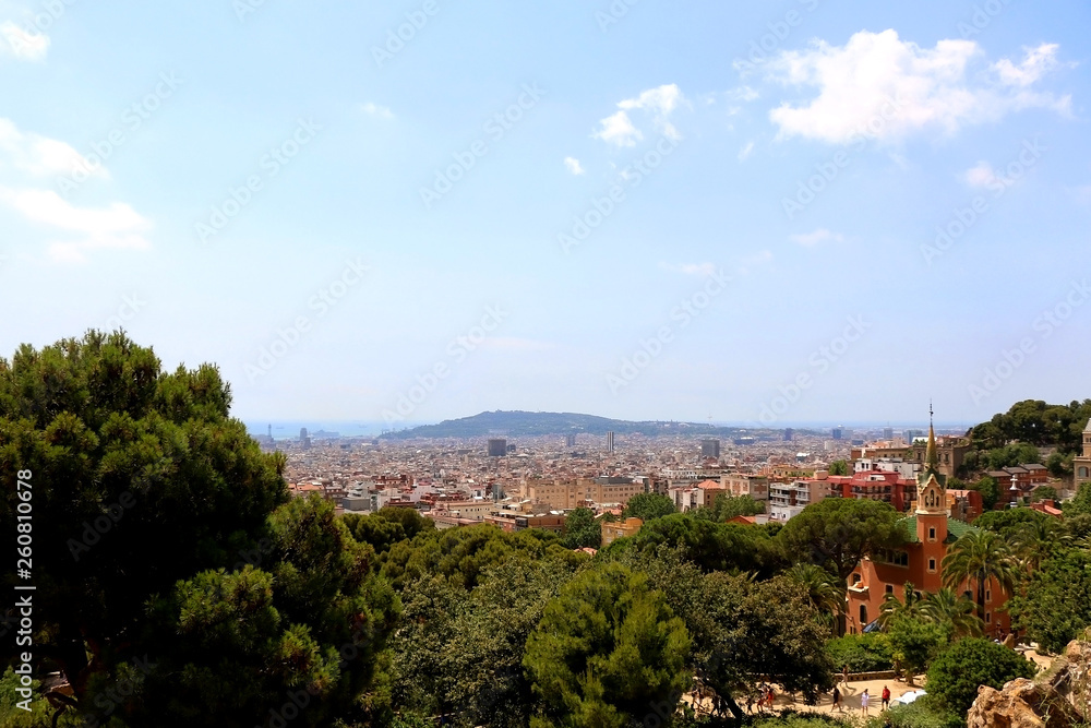 Aerial view of Barcelona from Park Güell with The Gaudi House Museum in the foreground.