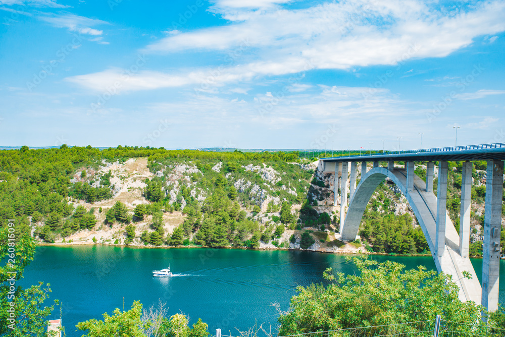 highway bridge cross river with blue water. summer time highway bridge cross river with blue water. summer time