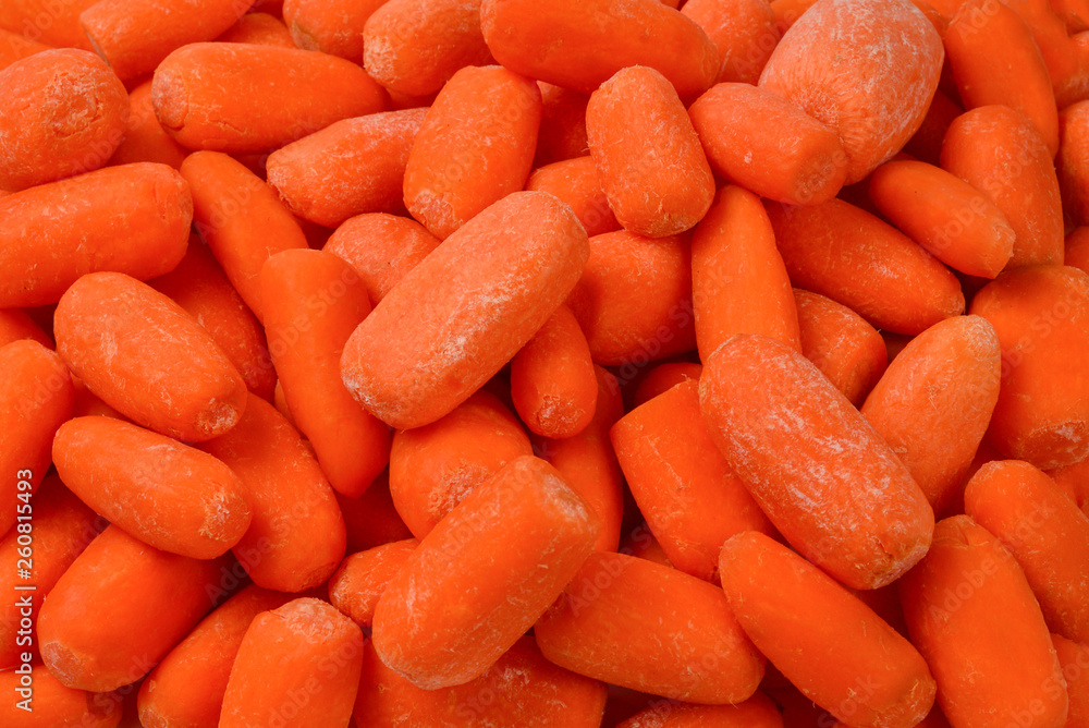 Little fresh carrots as a background. Snack. Little fresh carrots as a background. Snack.