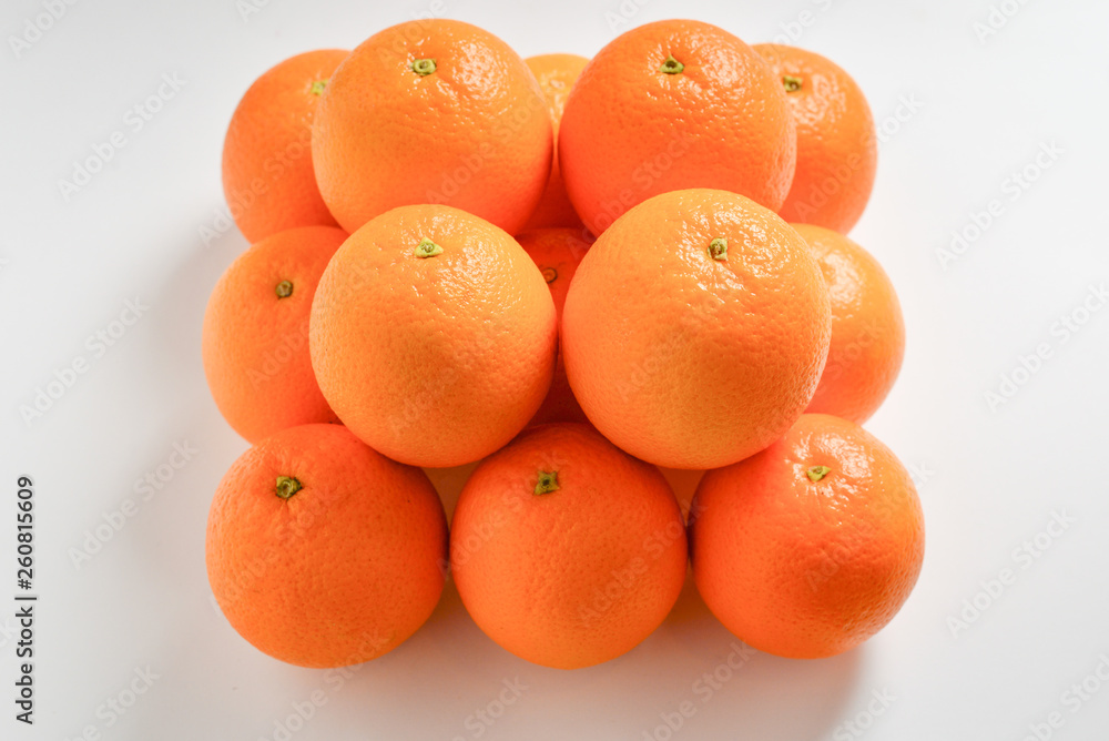 Pyramid of Oranges isolated on white background.