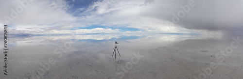 An action cam in the Salar de Uyuni flooded after the rains, Bolivia. Clouds reflected in the water of the Salar de Uyuni, Bolivia